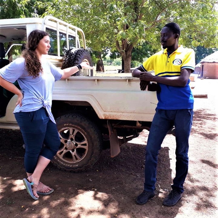 Kelly Lower (Mississippi State University) chats in 2018 with Daniel Nbedobe Kunji, SUNS II team translator and community liaison for men’s focus group discussion in villages in Saboba District in Ghana’s Northern Region.